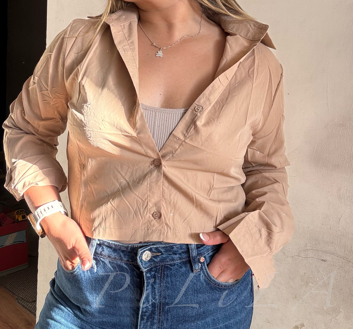 Blusa corta con brillo